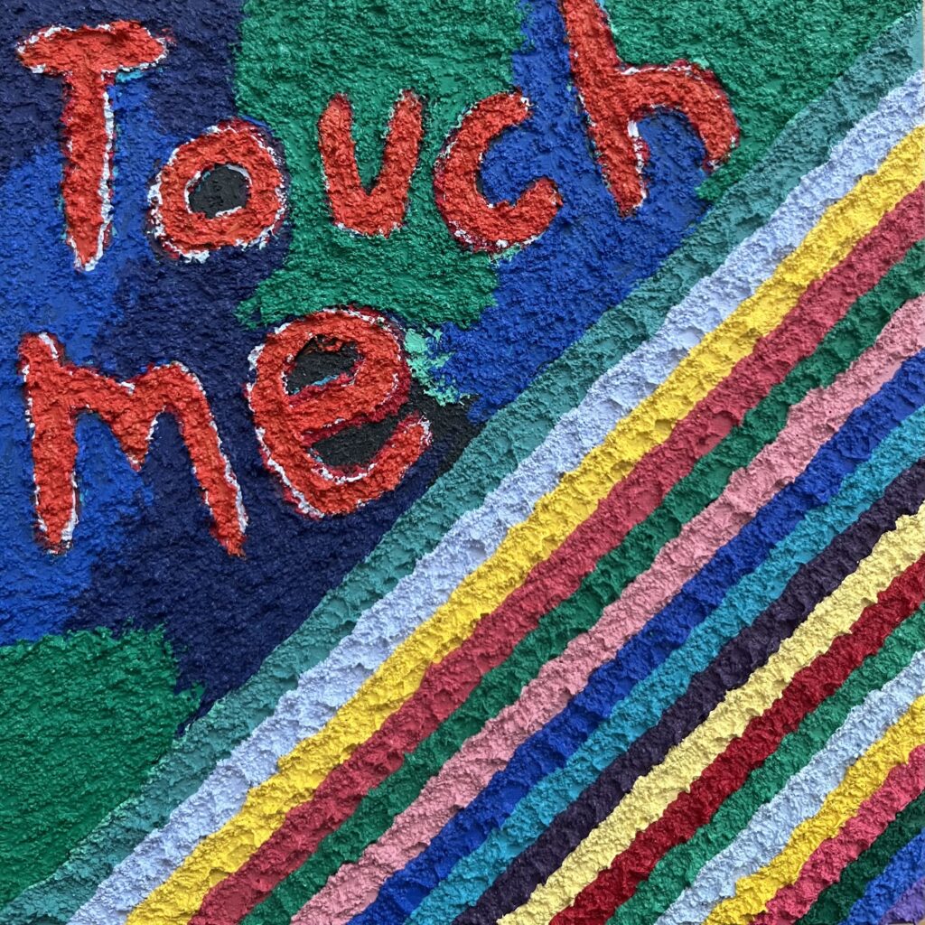 a colorful painting with the words "touch me" written on it
